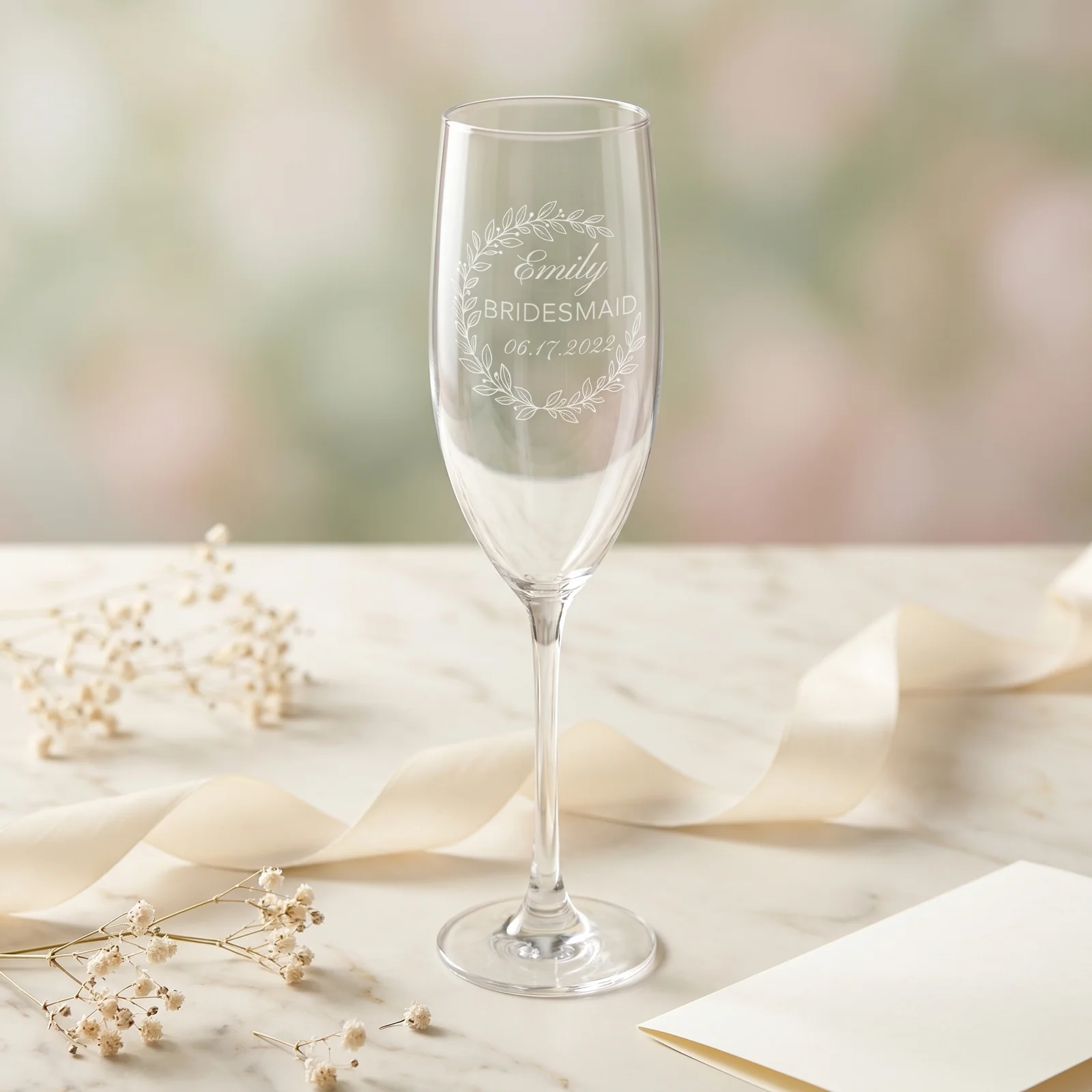 A bridesmaid proposal gift scene with flute and ribbon.