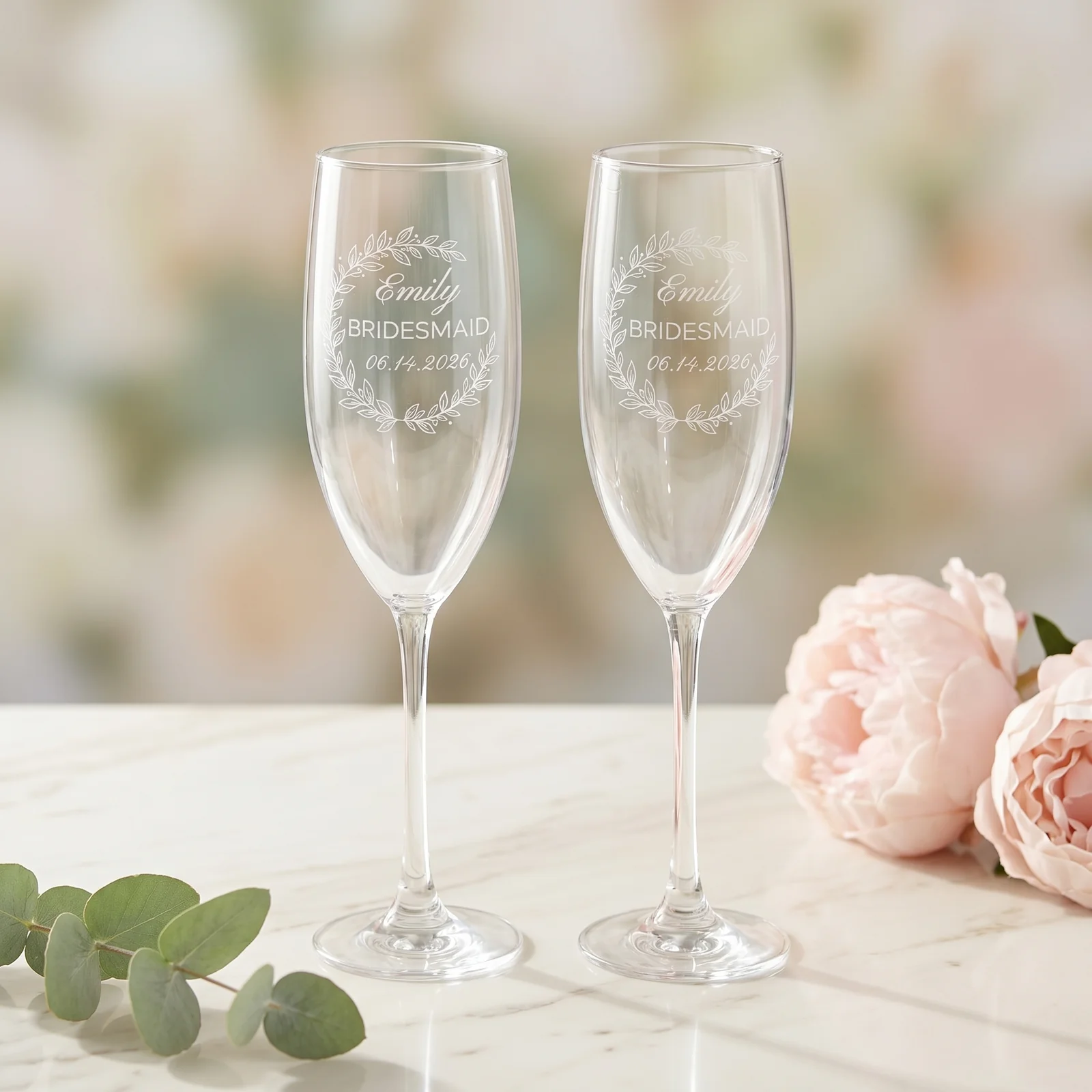 Two matching personalized champagne flutes side by side.