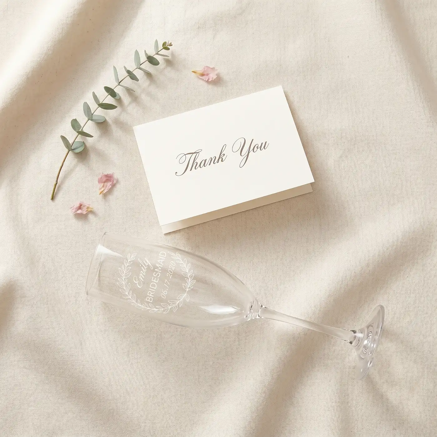 A handwritten thank-you card on linen.
